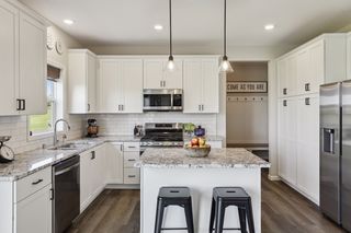 Storage is plentiful in the kitchen island,
 perimeter and pantry cabinetry.