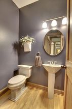 The 1/2 bath space is conveniently located on the main floor off the entry area.