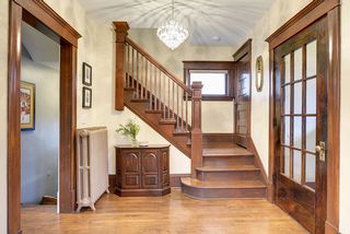 The Large Entry Foyer features an Open Staircase & Original Entry Vestibule...
