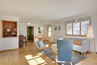 The Light-Filled Living Room features gleaming Hardwood Floors! 
