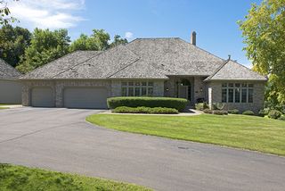 This home has an attractive brick front with cedar shake roof!