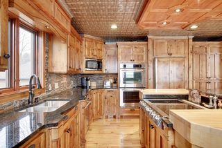 The integral bowl stainless sink is flanked by a tile pencil sticked backsplash.