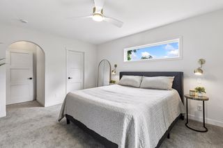Plenty of space for a king-sized bed with hardwired reading lamps, new trim, paint, carpet, and a clerestory window for privacy with natural light
