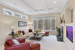 Main level great room is open to the kitchen and brings in so much outside light.