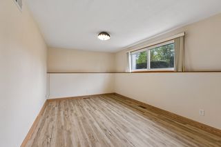 Spacious, refreshed lower-level family room with new flooring