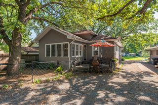 Deck off the kitchen offers summer outdoor seating, and access to oversized two car garage and gate to Kenilworth Trail. 