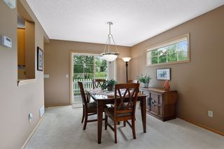 Dining with walk-out access to patio.