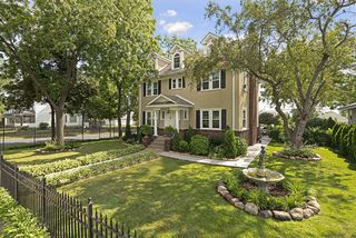 Located on a STUNNING Corner Lot, this home exudes grace & elegance...