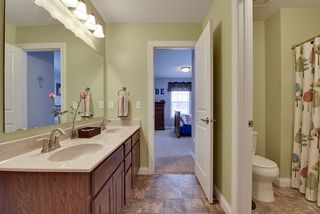 Full bath with double vanity opens to two of the junior bedrooms on the second floor.