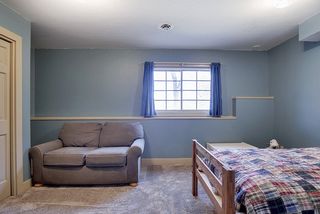 Bedroom #5 on the lower level with lookout window to the back yard