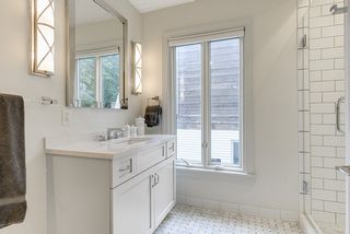 Main level full bath with Cambria vanity, marble floors and ceramic tile