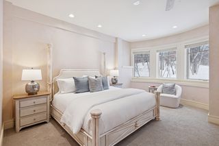 The bedroom suite is illuminated with separate lighting for each area.