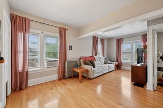 View of Living room in Apt #3.
Features Refinished Hardwood floors all newer vinyl windows throughout.