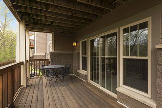 Walk out lower level slider onto another deck. 