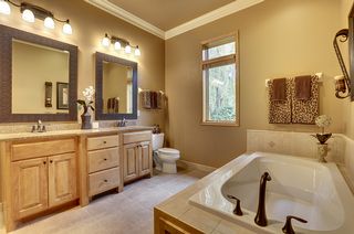 Owners bath with granite custom double vanity and double crown molding
