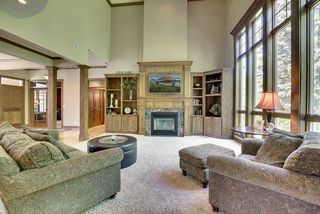 Large - 2 story Great Room with story and a half windows overlooking the backyard and wooded area.