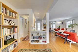 You will find many Mid-Century Modern details, including this Open Staircase with Bookshelves...