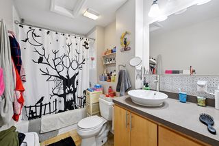 Updated bathroom features Subway tile, custom Maple Vanity and Travertine tile flooring. Located off kitchen.