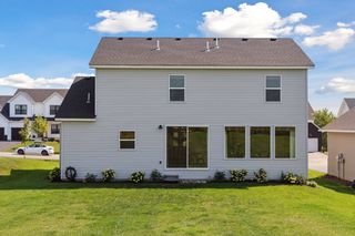 The rear elevation of the home has nice exterior qualities.  
Healthy bushes, plants , sod and an irrigation system
 add lots of value to the property.