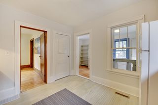 View of kitchen leading to dining room and back bonus/craft/office/mud room.