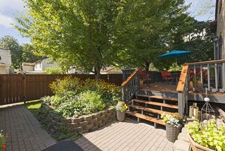 The Back Yard features Stone Pavers, Raised Garden Beds & Oversized Deck! 
