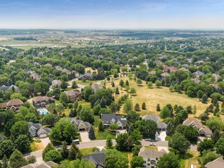 No houses directly behind the you, just open green space and walking paths nearby.