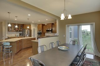 open to the kitchen and access to the back yard through the large sliding glass door