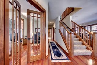Cherry trims and cherry stair parts reflect a craftsmen styling throughout.