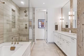 Spacious primary suite bath with soaking tub, walk-in shower, dual vanity and water closet.