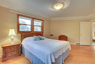 5024 Park Avenue - Spacious main floor bedroom with gleaming hardwood floors and beautiful ceiling detail
