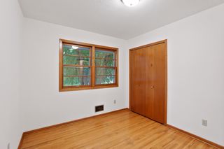 Bedroom Three has natural wood floors, 
and a double window  and closet.