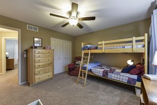 Bedroom 4 with ceiling fan on the upper level