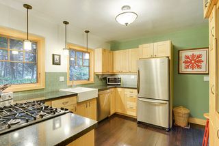 WOW! Take in the completely private views of the Back Yard from your Custom Kitchen...