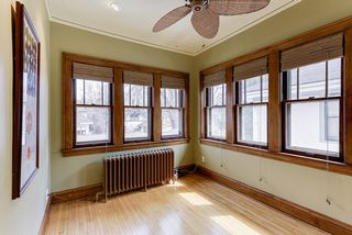 4349 Aldrich sunroom has lots of windows and a pass-through window from the kitchen.
