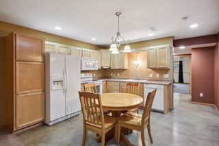 Basement has full kitchen with heated stained concrete floors