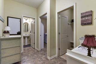 Area between the kitchen and garage, mainfloor laundry, mud room, and powder room