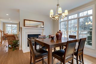 Beautiful dining area warmed by the light and the fireplace