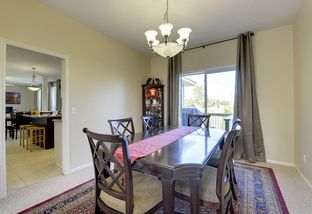 Formal dining room over look patio & backyard