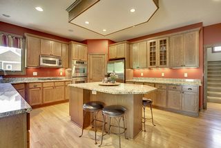 Granite countertops, gas cooktop, corner sink round off this spacious, gourmet kitchen.