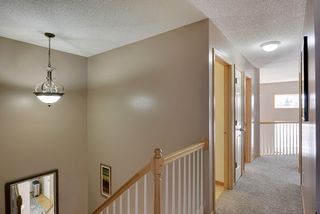 Upper Level & View Toward the Laundry, Bathroom, and Loft