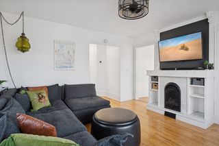 Upper level living room with decorative fireplace
