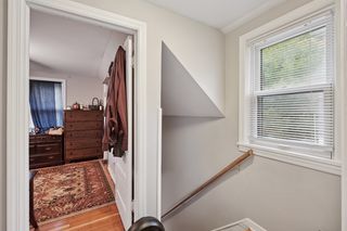 Top of stairs leads to 2 bedrooms on upper level. Features thermal pane windows and hardwood floors.