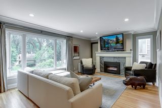 Spacious living room has recessed lighting and large picture window that provides a light, open feeling