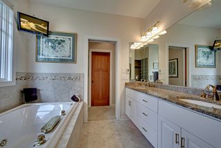 Carefully laid out Master Bath, whirlpool tub, heated, ceramic flooring, granite countertops.