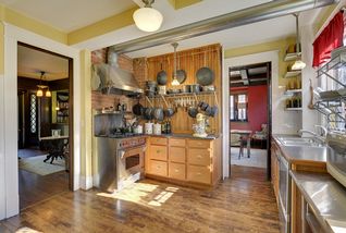 The Kitchen features a WOLF Commercial Range & Pass-Thru to the Dining Room! 