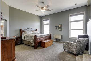 Master bedroom suite with private bath, custom walk-in closet, and adjoining study