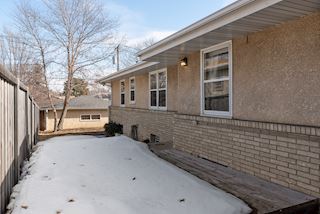 Wood deck with privacy fence on the north side of the home