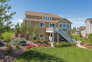 Lovely home with inviting deck and large paver patio...
