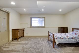 Bedroom #6 on the lower level with lookout windows to the back yard