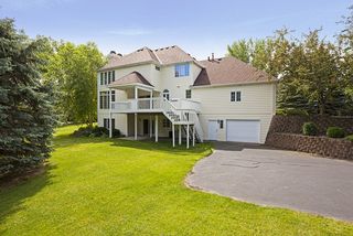 The Lower 4 car Garage is heated - a wraparound driveway from the front entry approaches the rear driveway.